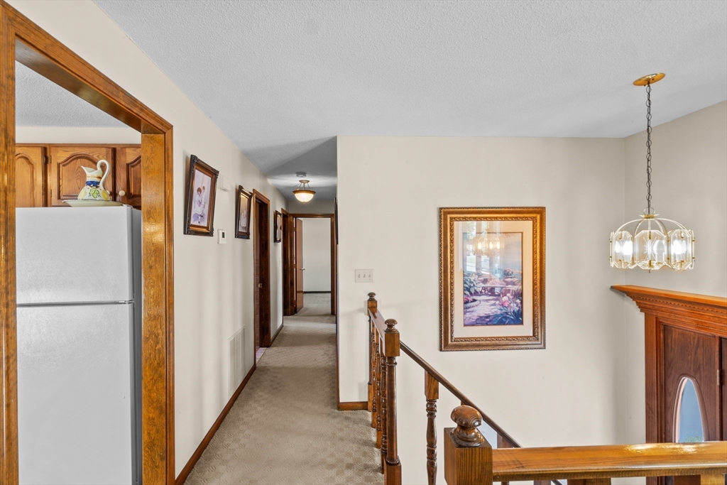 403 Aetna Street Fall River, MA 02721 - Photo 19 of 42 a view of a hallway with wooden floor and entryway