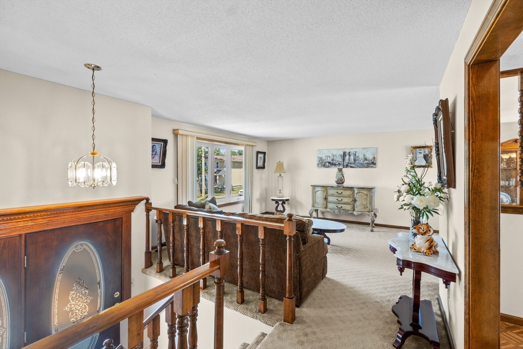 403 Aetna Street Fall River, MA 02721 - Photo 20 of 42 a view of a livingroom with furniture window and wooden floor