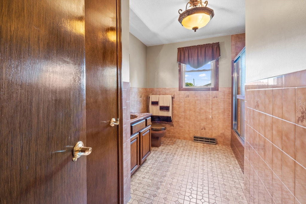 403 Aetna Street Fall River, MA 02721 - Photo 22 of 42 a view of a bathroom with mirror