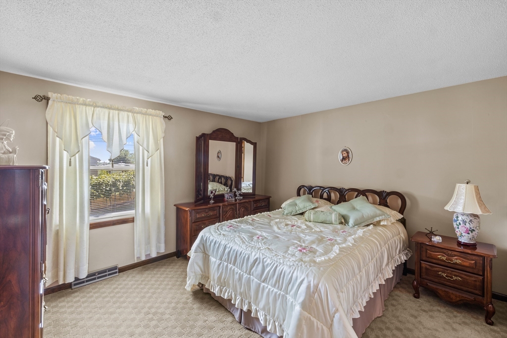 403 Aetna Street Fall River, MA 02721 - Photo 24 of 42 a bedroom with a bed and a window