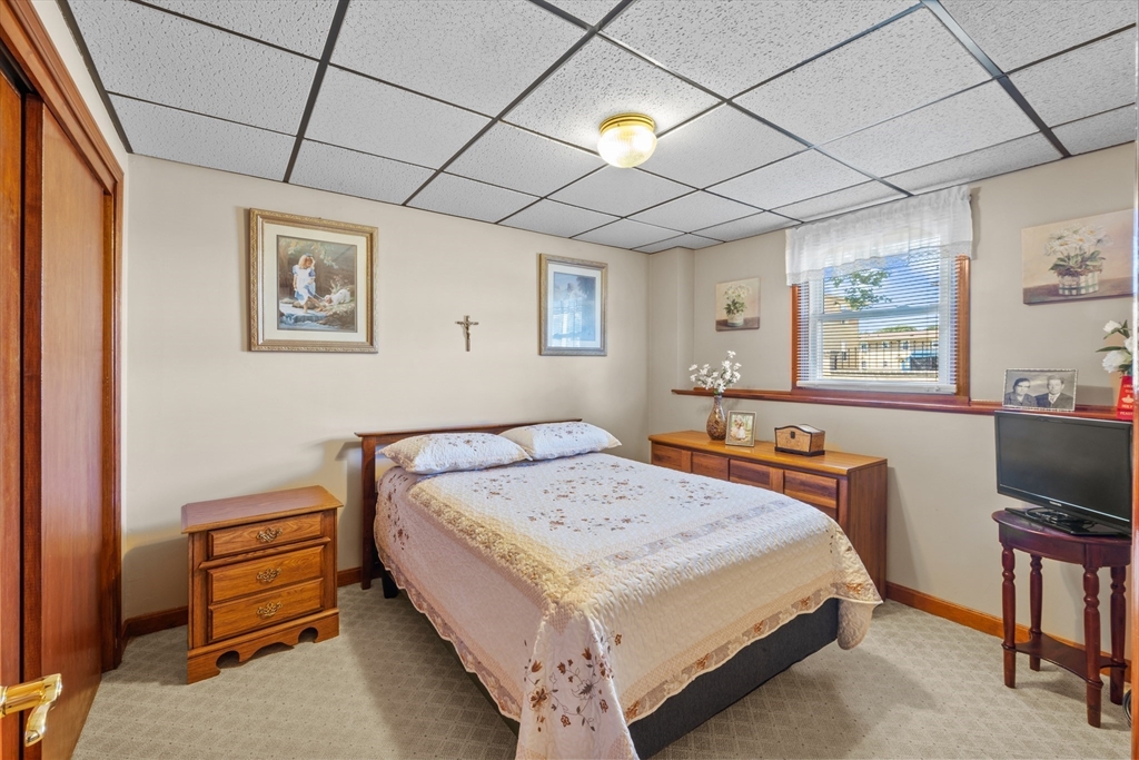 403 Aetna Street Fall River, MA 02721 - Photo 34 of 42 a bedroom with a bed and a desk