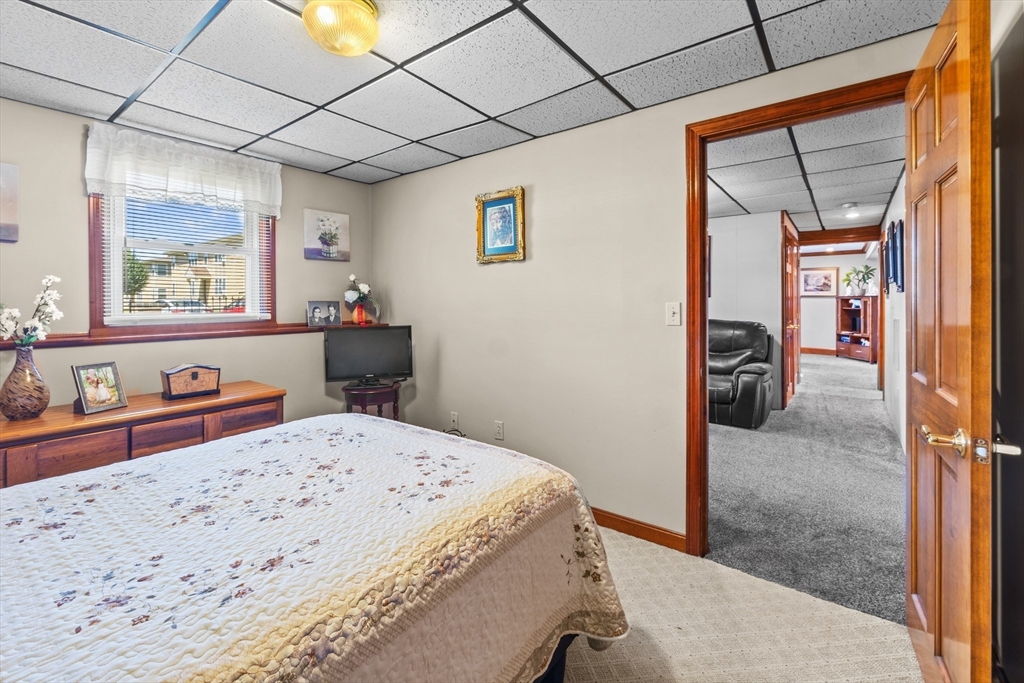 403 Aetna Street Fall River, MA 02721 - Photo 35 of 42 a bedroom with a bed and a dresser