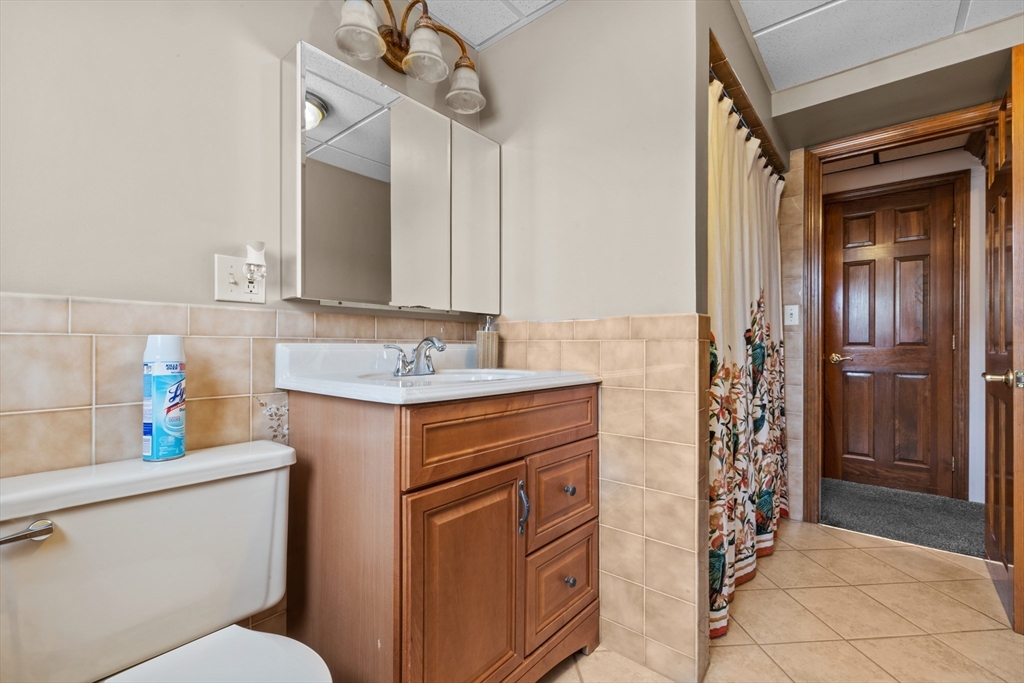 403 Aetna Street Fall River, MA 02721 - Photo 39 of 42 a bathroom with a sink a toilet and shower