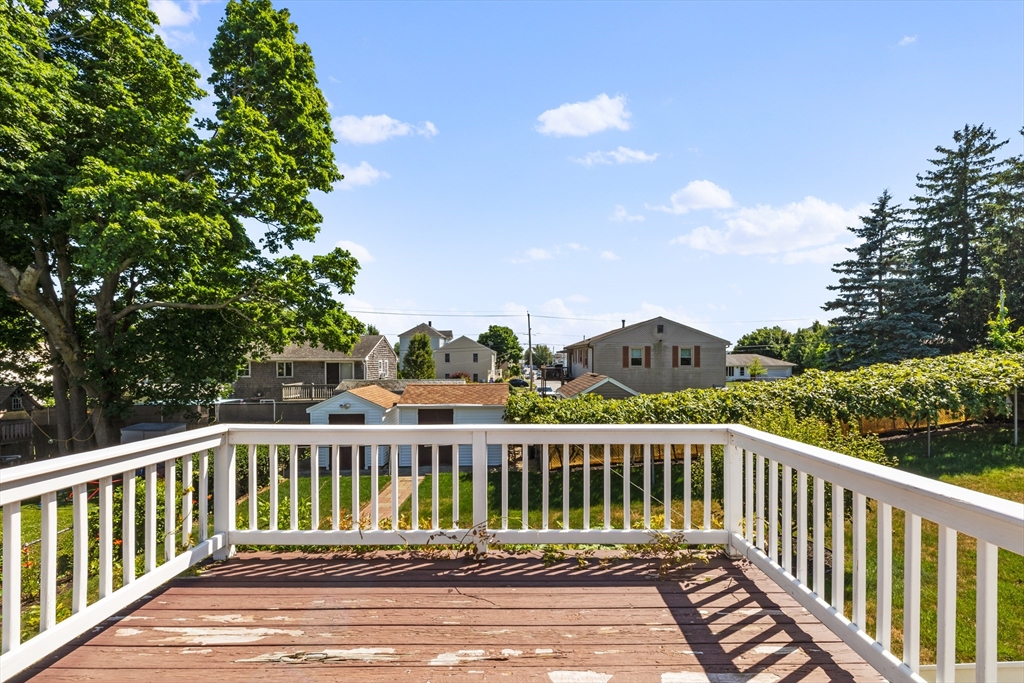 403 Aetna Street Fall River, MA 02721 - Photo 41 of 42 a view of balcony with wooden floor and fence