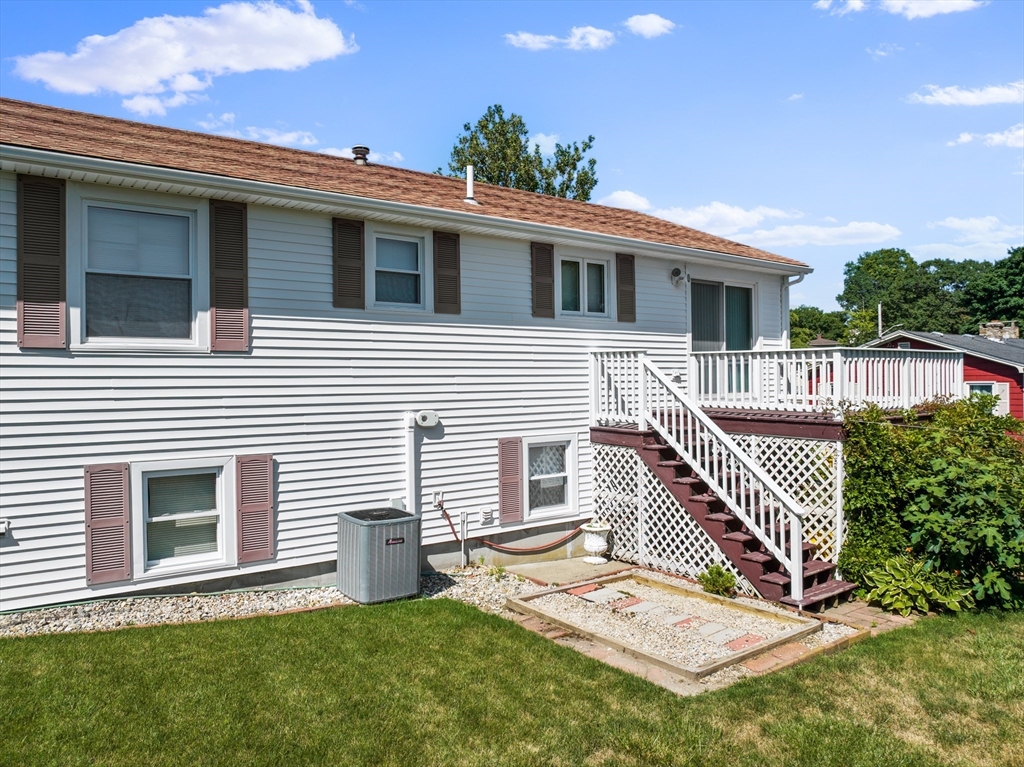 403 Aetna Street Fall River, MA 02721 - Photo 7 of 42 a front view of a house with a yard