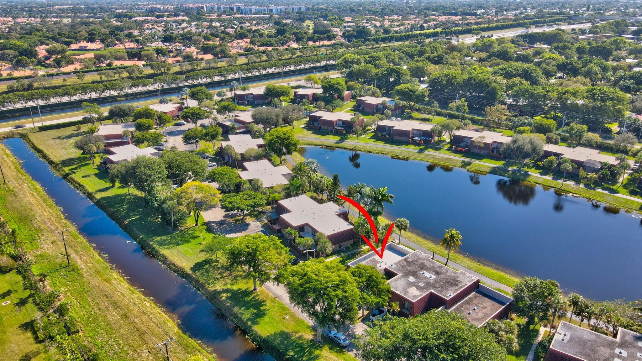 8073 Boca Rio Drive Boca Raton, FL 33433 - Photo 54 of 56 an aerial view of residential houses with outdoor space and swimming pool