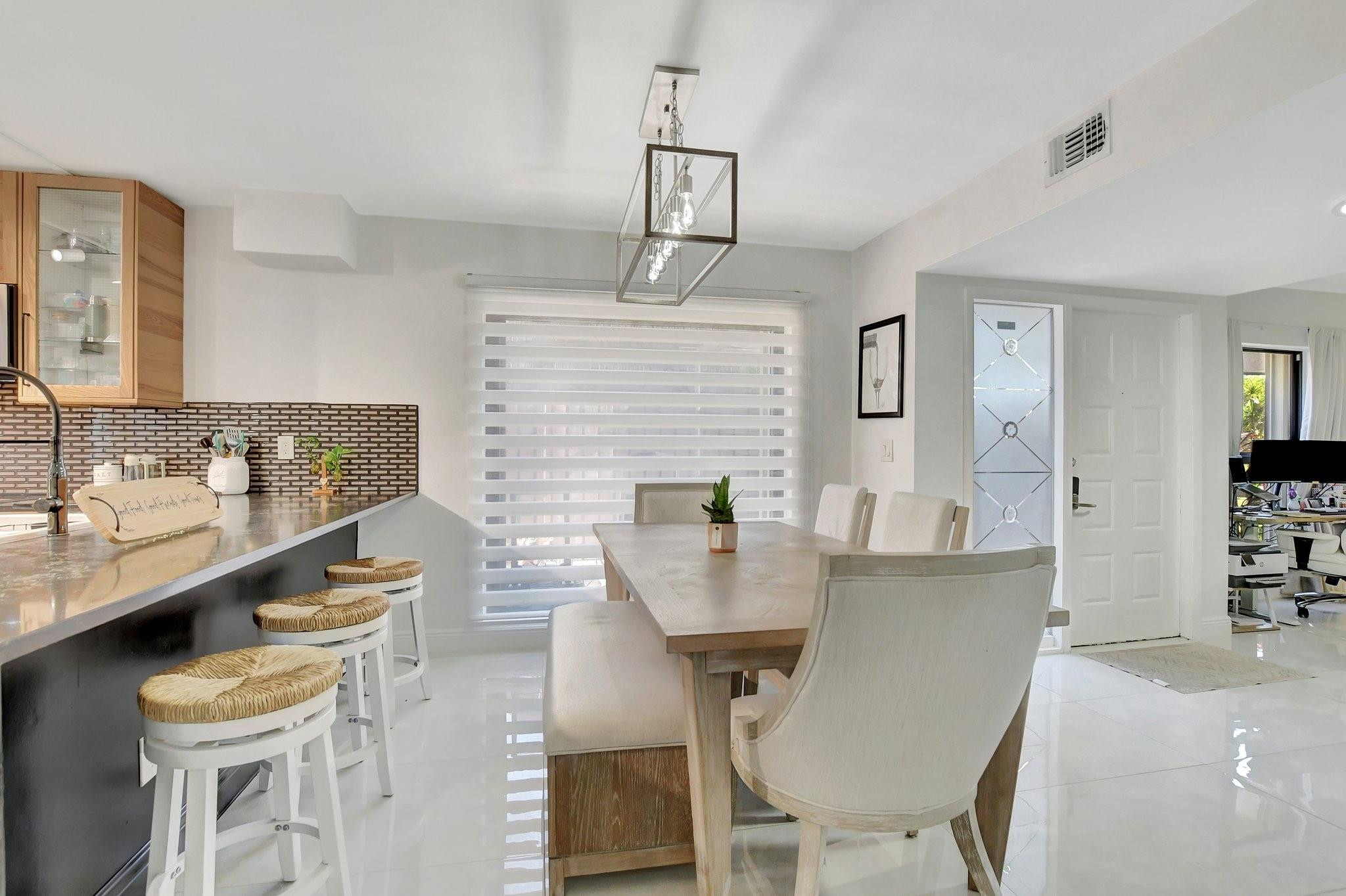 8073 Boca Rio Drive Boca Raton, FL 33433 - Photo 8 of 56 a dining room with furniture and window