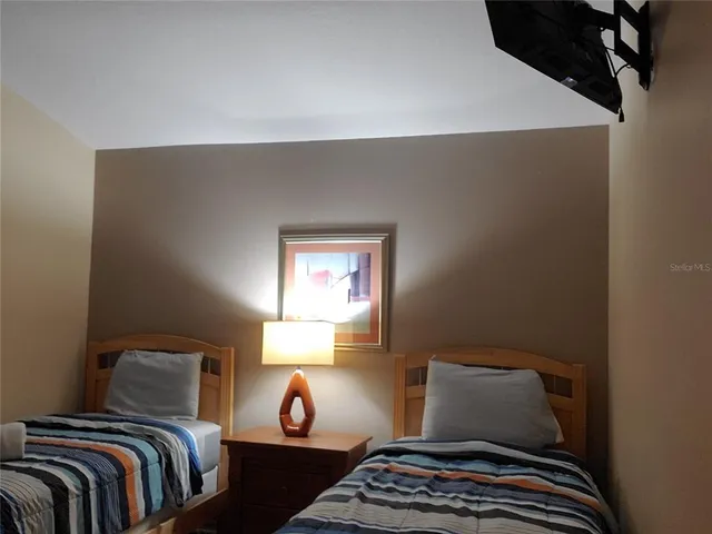 a bedroom with a bed and a fireplace