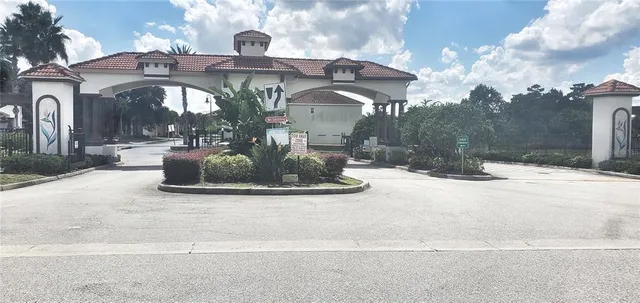 a kitchen with stainless steel appliances a stove a microwave a sink and cabinets