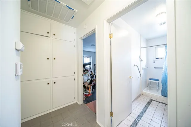 a bedroom with a bed and a closet