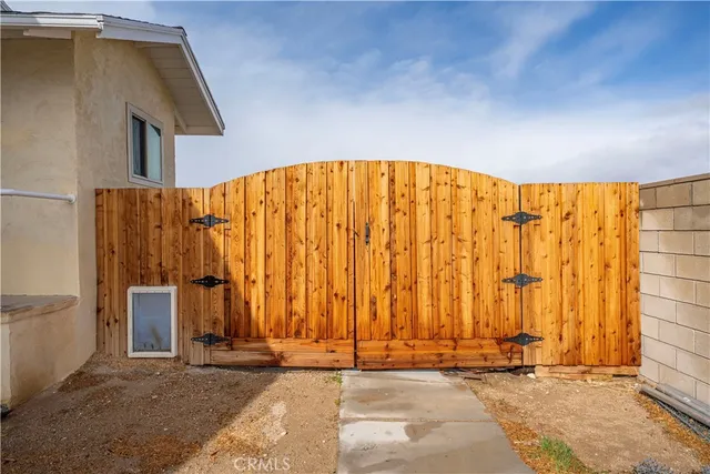 a view of wooden stairs and a wooden bench