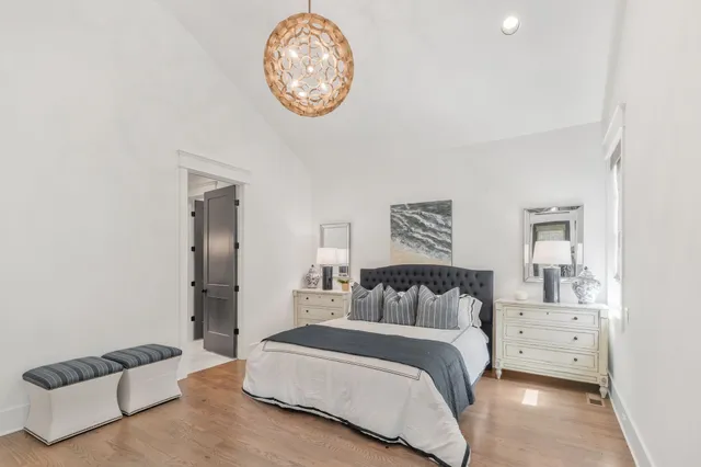 a spacious bathroom with a tub sink shower and mirror