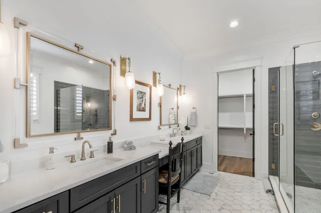 a spacious bathroom with a tub sink and mirror
