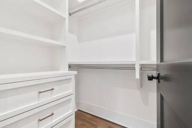 a view of an empty walk in closet