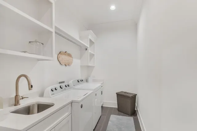 a view of storage and utility room with wooden floor
