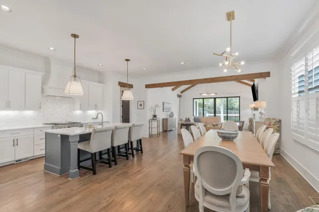 a very nice looking dining room with furniture window and wooden floor