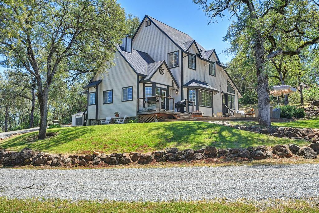 3154 Twin K Road Pilot Hill, CA 95664 - Photo 13 of 89 a front view of a house with a garden