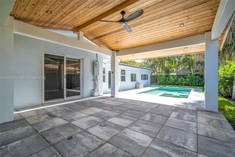 a view of a swimming pool with a yard