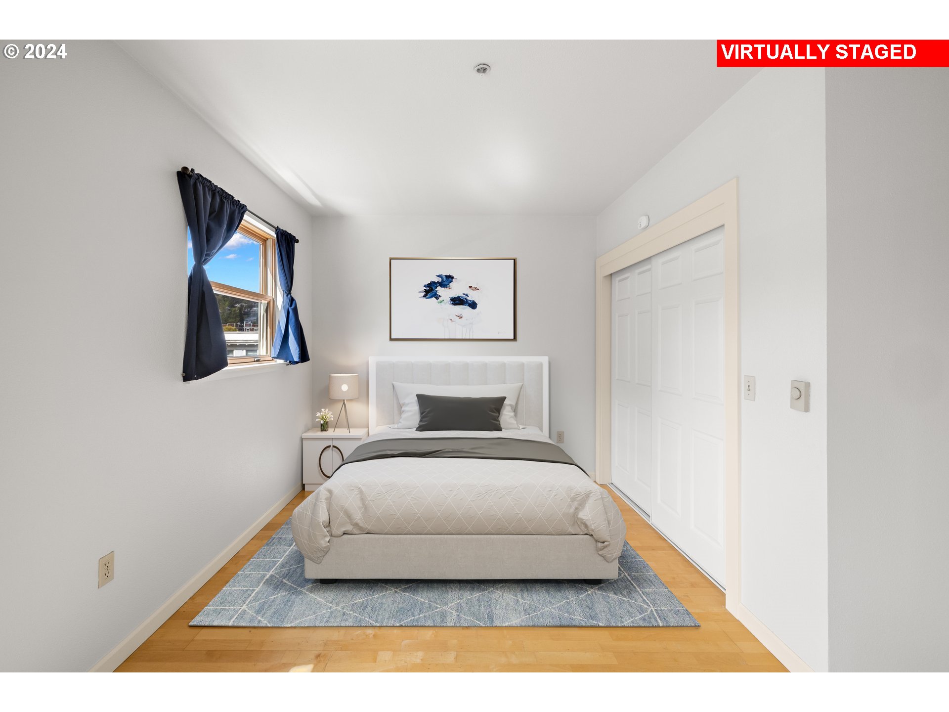 1134 Southwest Jefferson Street, Unit 508 Portland, OR 97201 - Photo 16 of 29 a bedroom with a bed and a painting on the wall