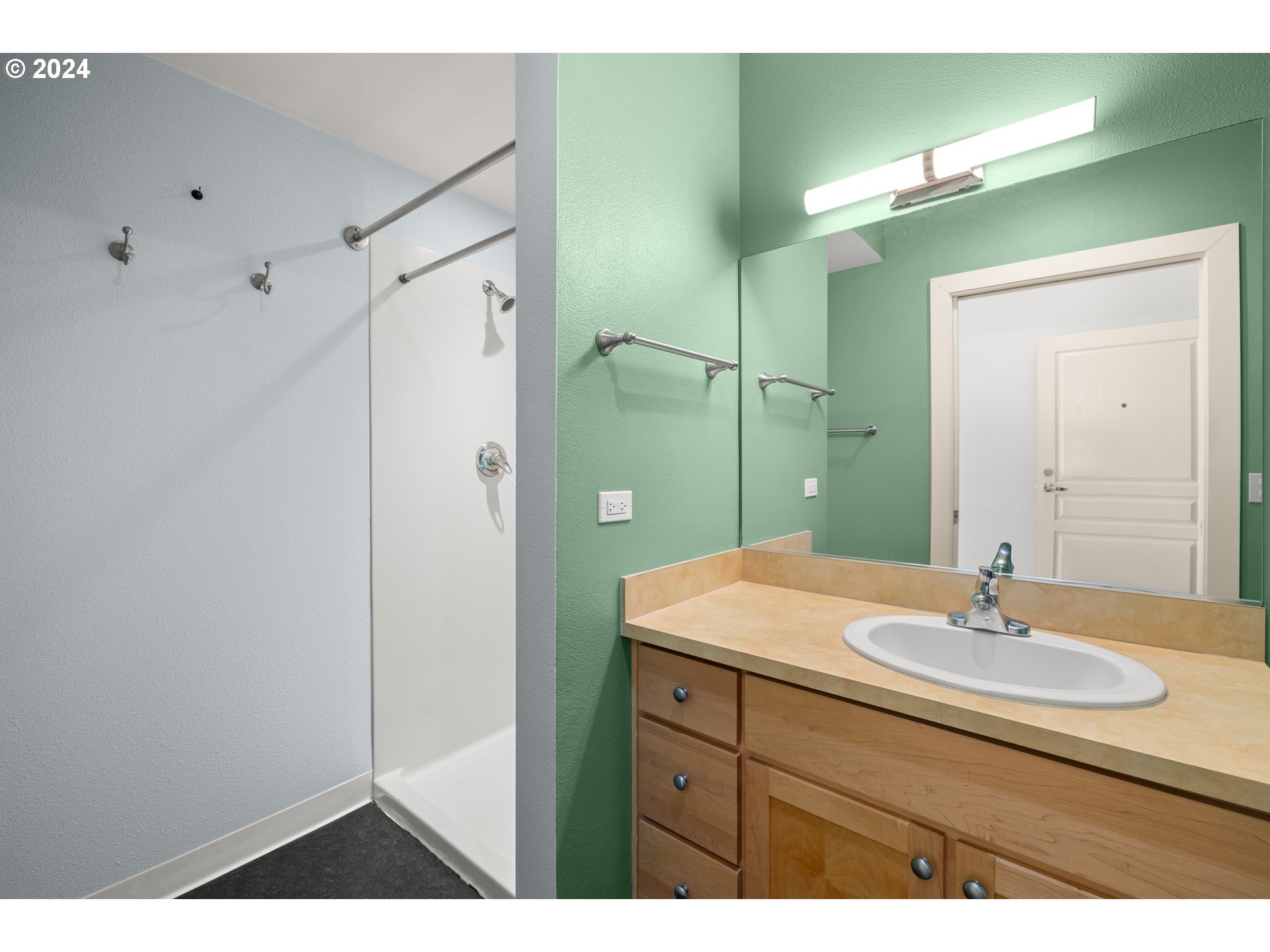 1134 Southwest Jefferson Street, Unit 508 Portland, OR 97201 - Photo 18 of 29 a bathroom with a sink and a mirror
