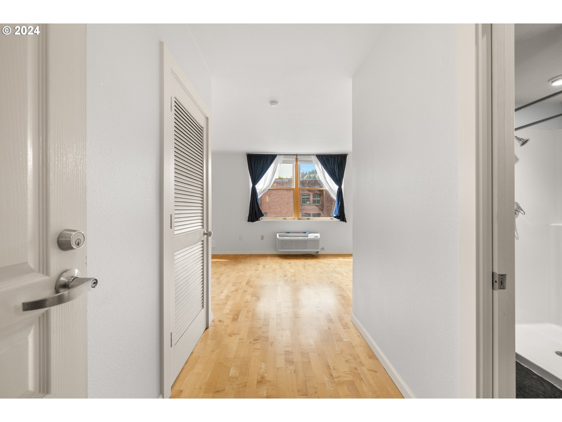 1134 Southwest Jefferson Street, Unit 508 Portland, OR 97201 - Photo 6 of 29 a view of a living room with a wooden floor