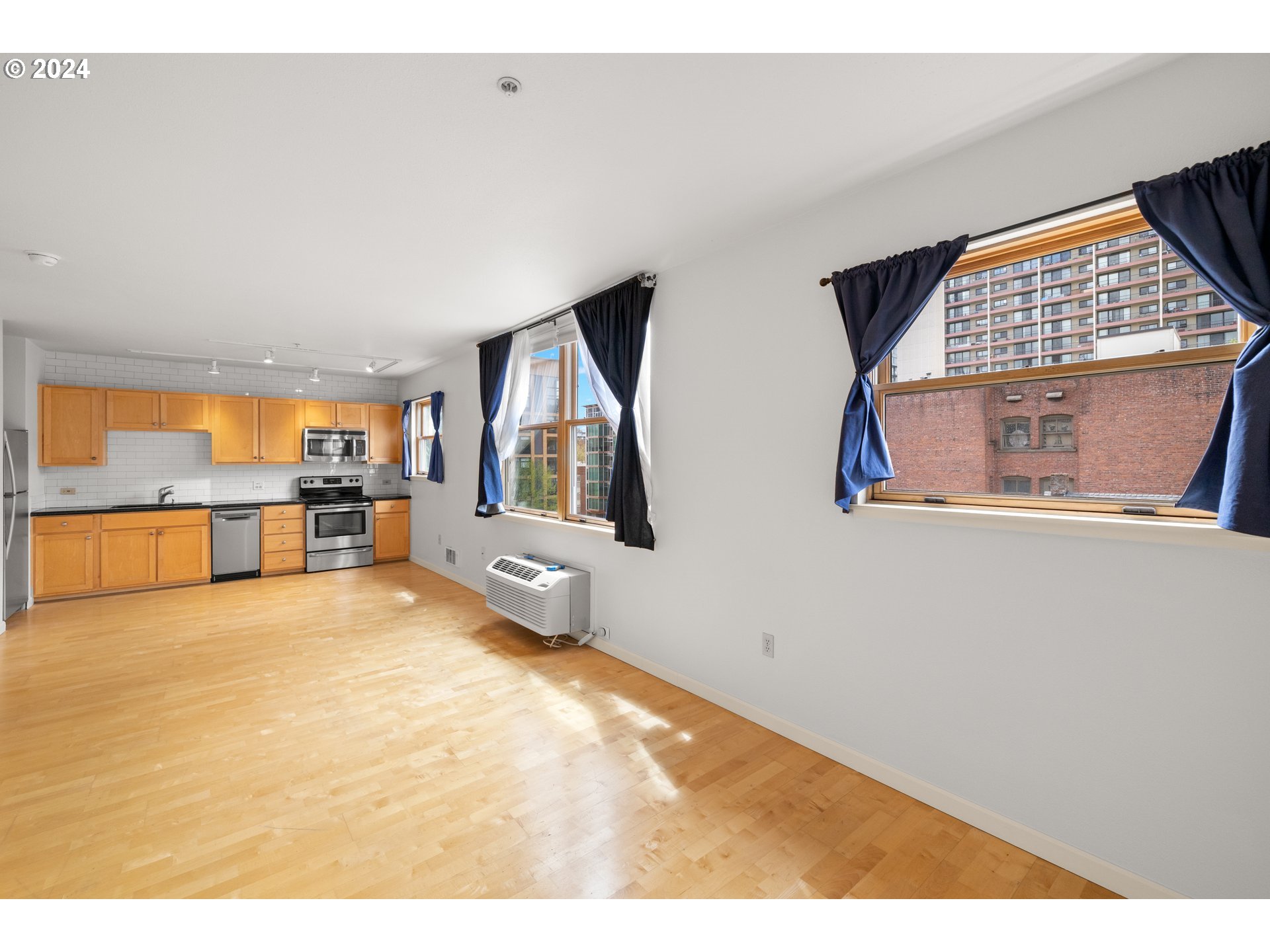 1134 Southwest Jefferson Street, Unit 508 Portland, OR 97201 - Photo 9 of 29 a view of an empty room with a window