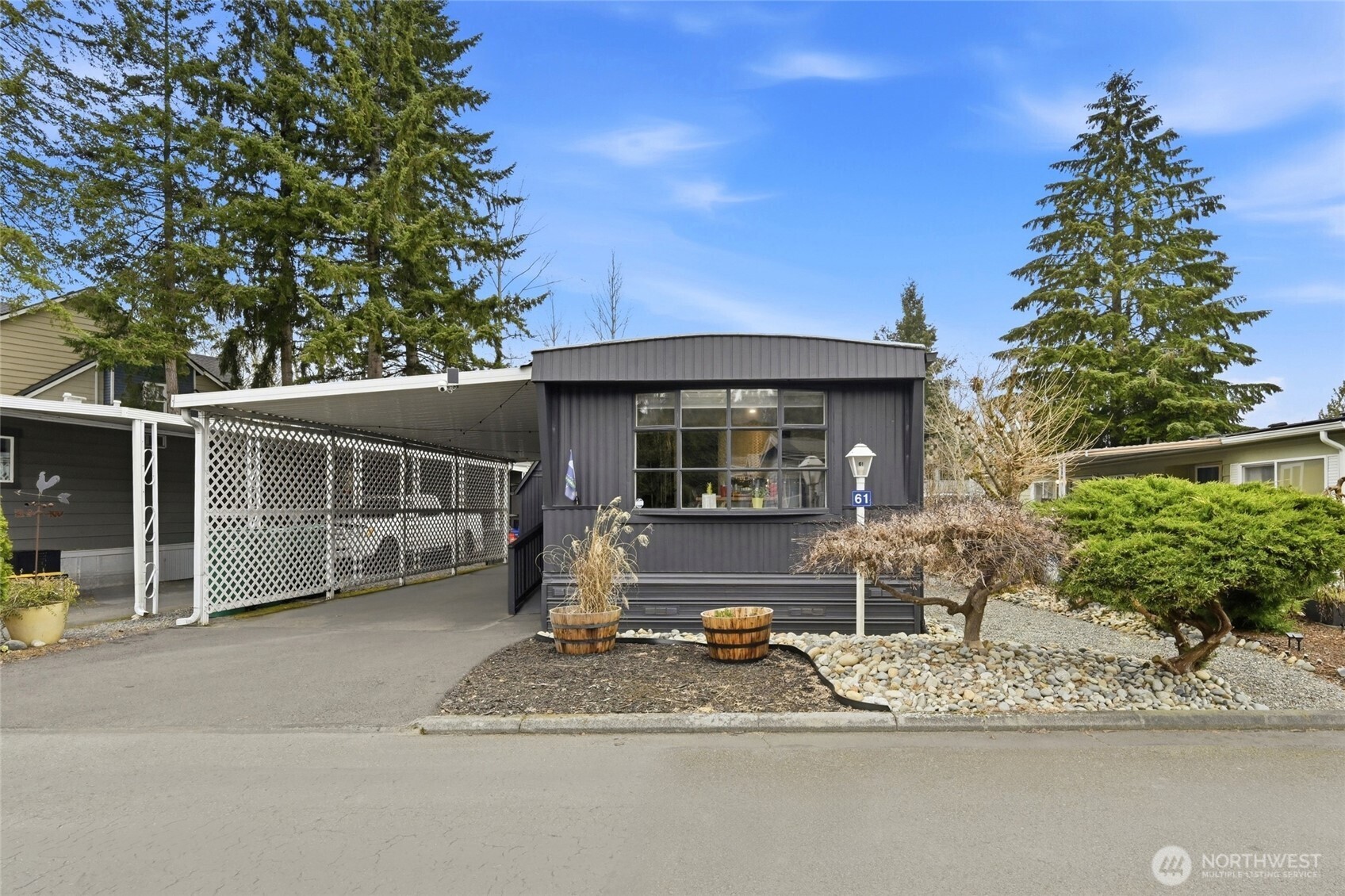 2200 196th Street Southeast, Unit 61 Bothell, WA 98012 - Photo 1 of 21 a front view of a house with garden