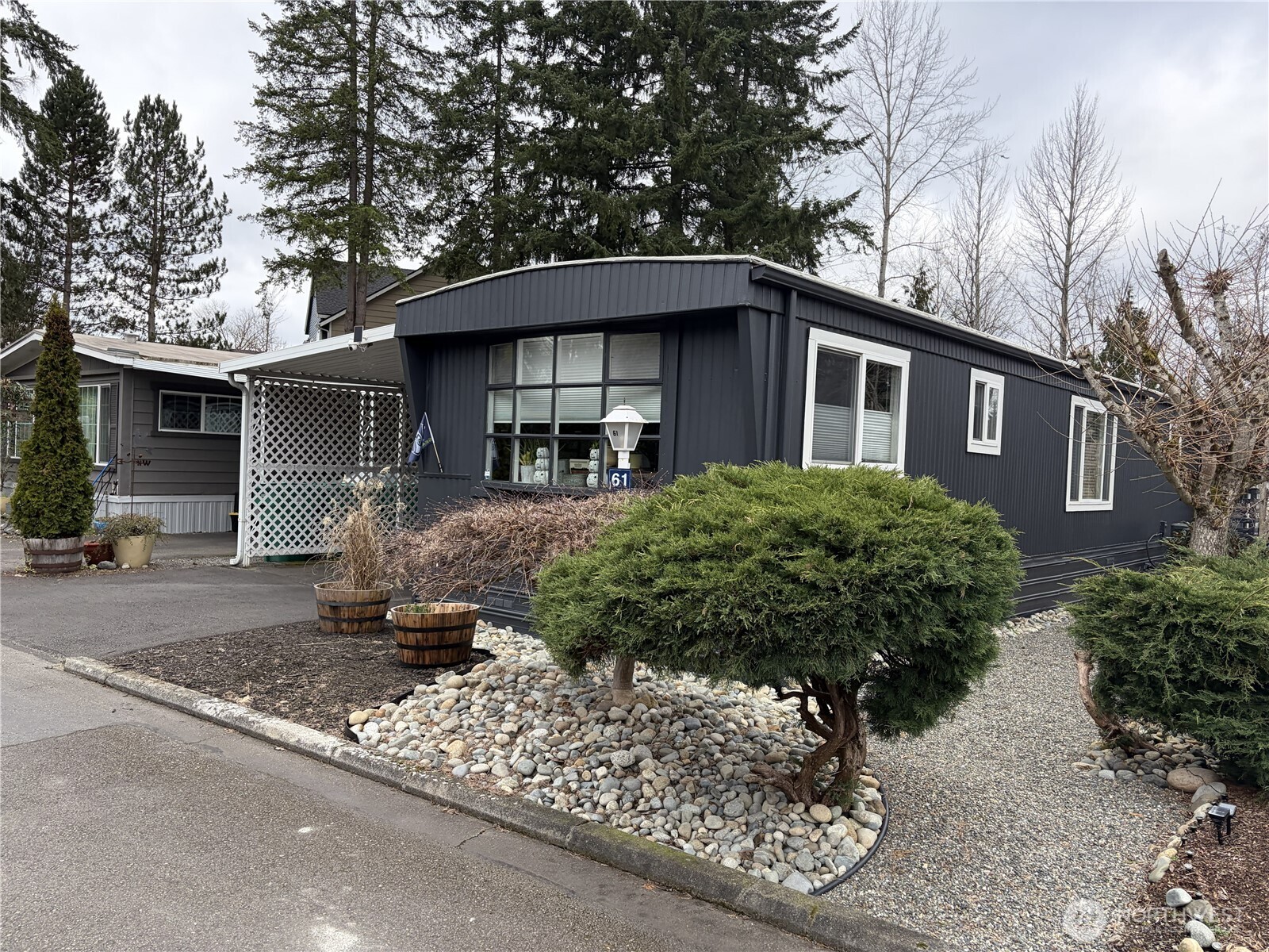 2200 196th Street Southeast, Unit 61 Bothell, WA 98012 - Photo 2 of 21 a front view of a house with garden