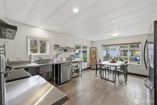 a view of a dining room with furniture window and wooden floor