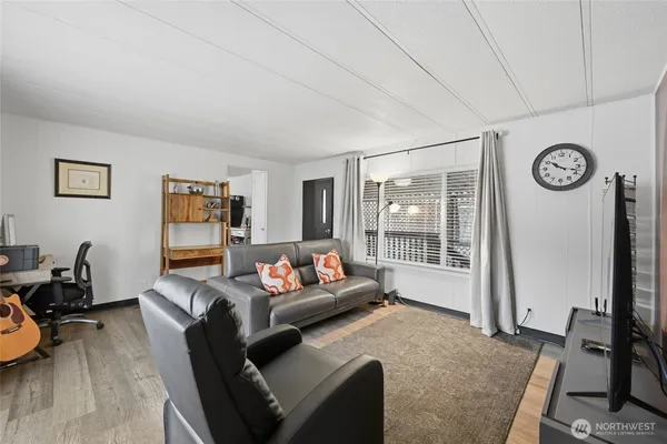 a living room with furniture and a window