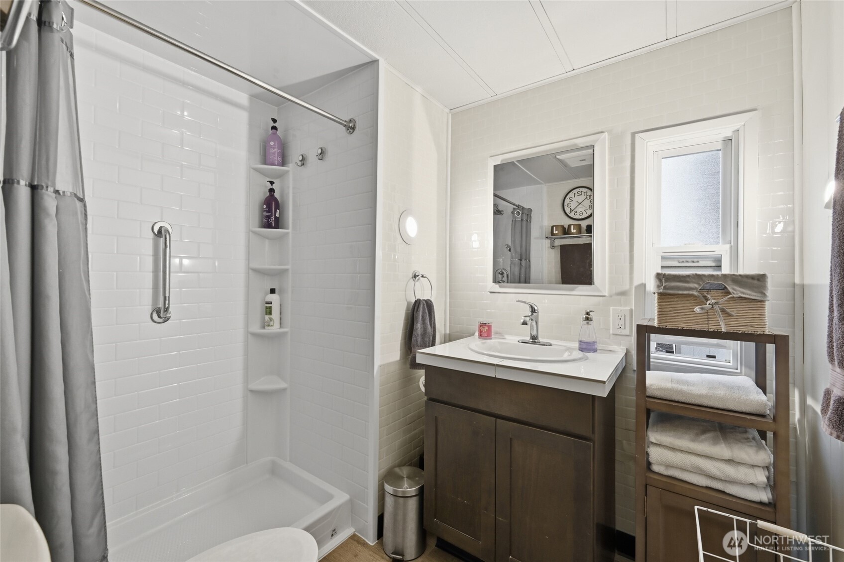 2200 196th Street Southeast, Unit 61 Bothell, WA 98012 - Photo 10 of 21 a bathroom with a double vanity sink mirror and shower