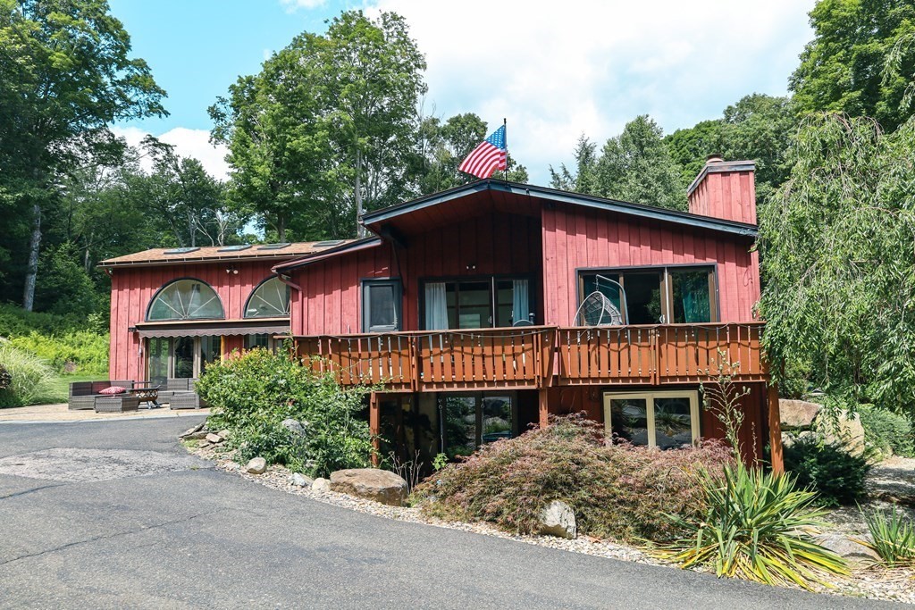 80 Rock-A-Dundee Road Hampden, MA 01036 - Photo 1 of 42 a front view of a house with a garden