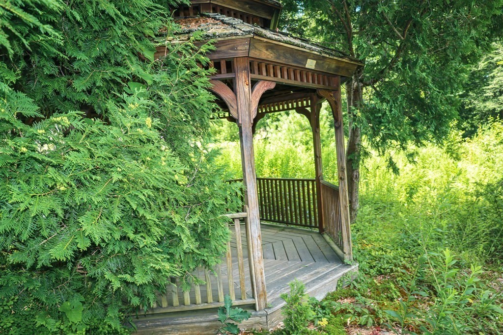 80 Rock-A-Dundee Road Hampden, MA 01036 - Photo 11 of 42 a view of a wooden door with a tree