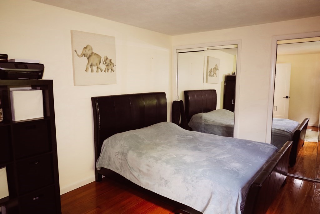 80 Rock-A-Dundee Road Hampden, MA 01036 - Photo 16 of 42 a bedroom with a bed and wooden floor