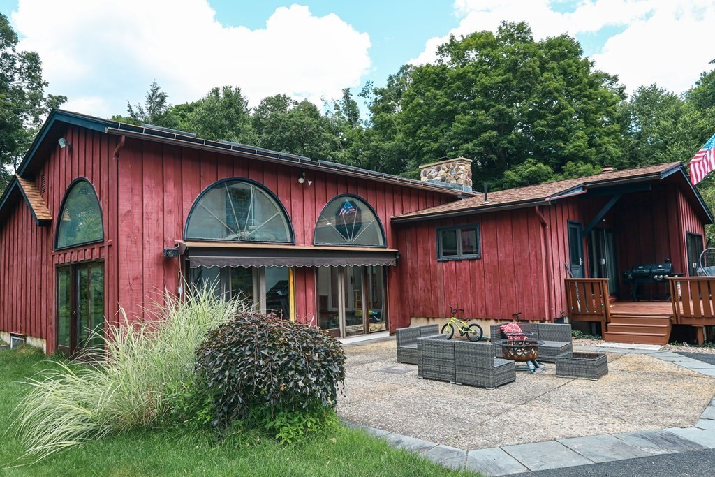 80 Rock-A-Dundee Road Hampden, MA 01036 - Photo 2 of 42 a front view of a house with yard and glass windows