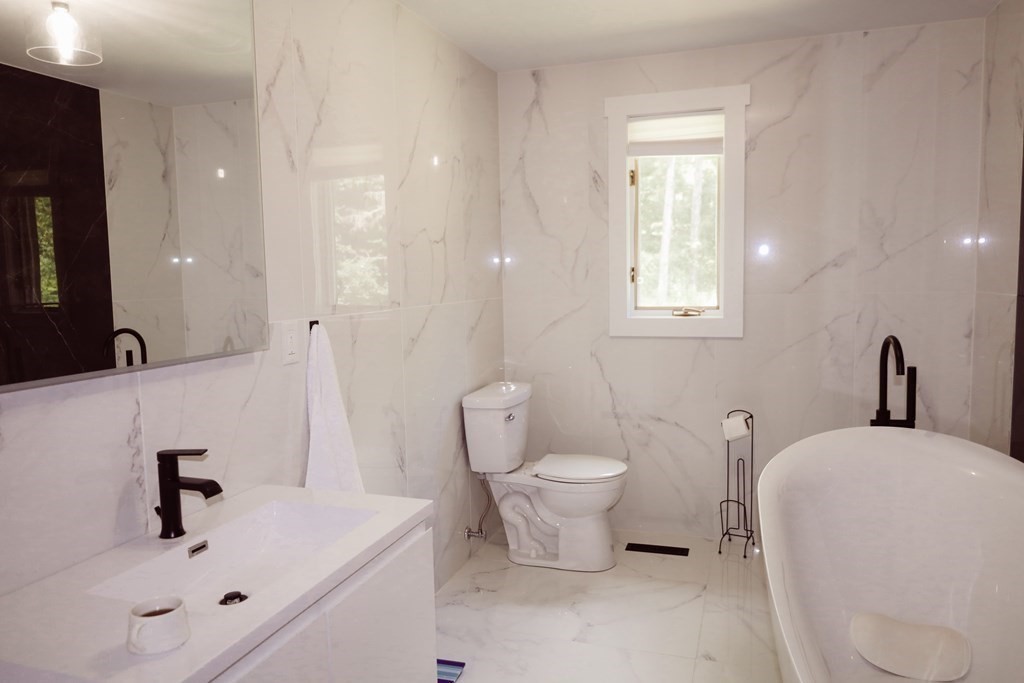 80 Rock-A-Dundee Road Hampden, MA 01036 - Photo 21 of 42 a bathroom with a toilet sink and mirror