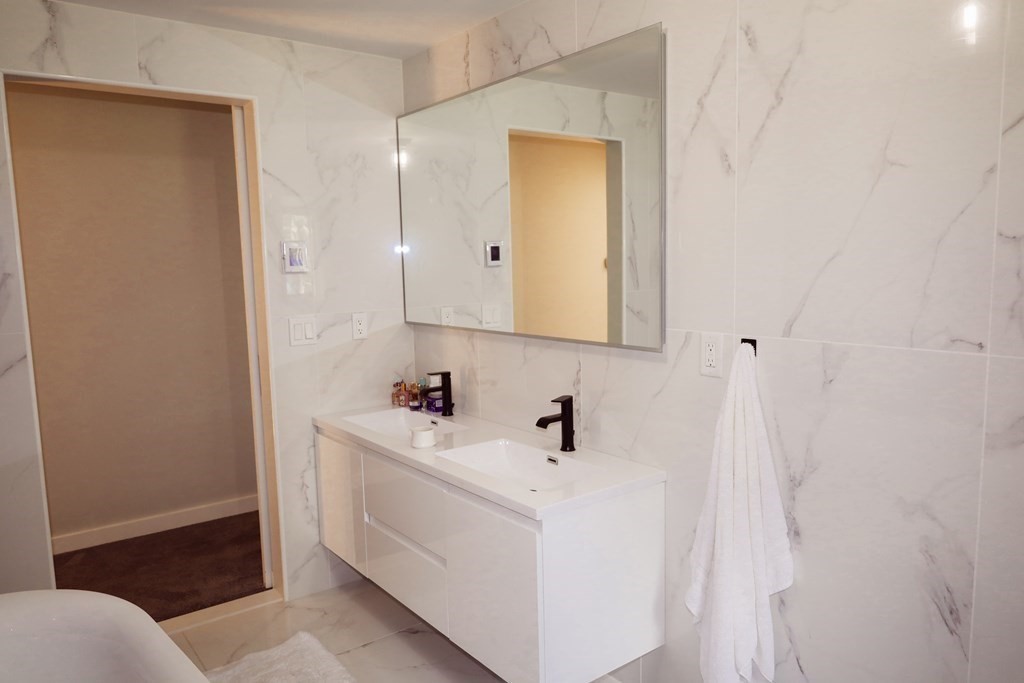 80 Rock-A-Dundee Road Hampden, MA 01036 - Photo 22 of 42 a bathroom with a sink and a mirror