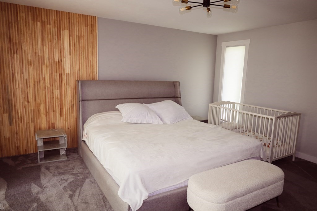 80 Rock-A-Dundee Road Hampden, MA 01036 - Photo 23 of 42 a bed room with a bed and a chair