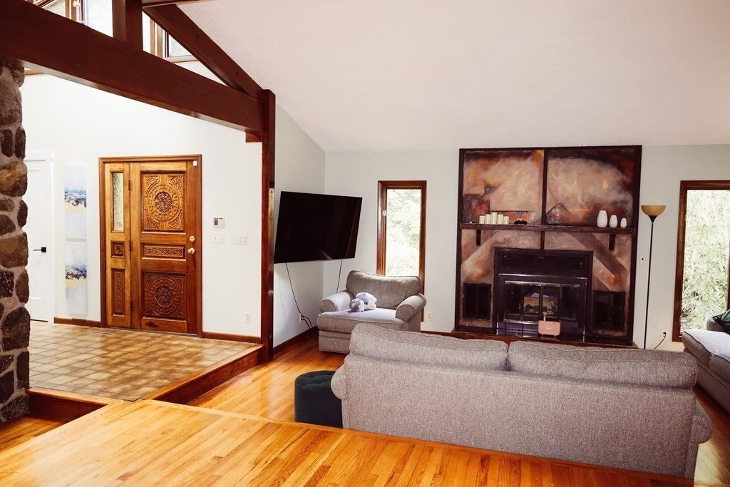 80 Rock-A-Dundee Road Hampden, MA 01036 - Photo 28 of 42 a living room with furniture and a flat screen tv