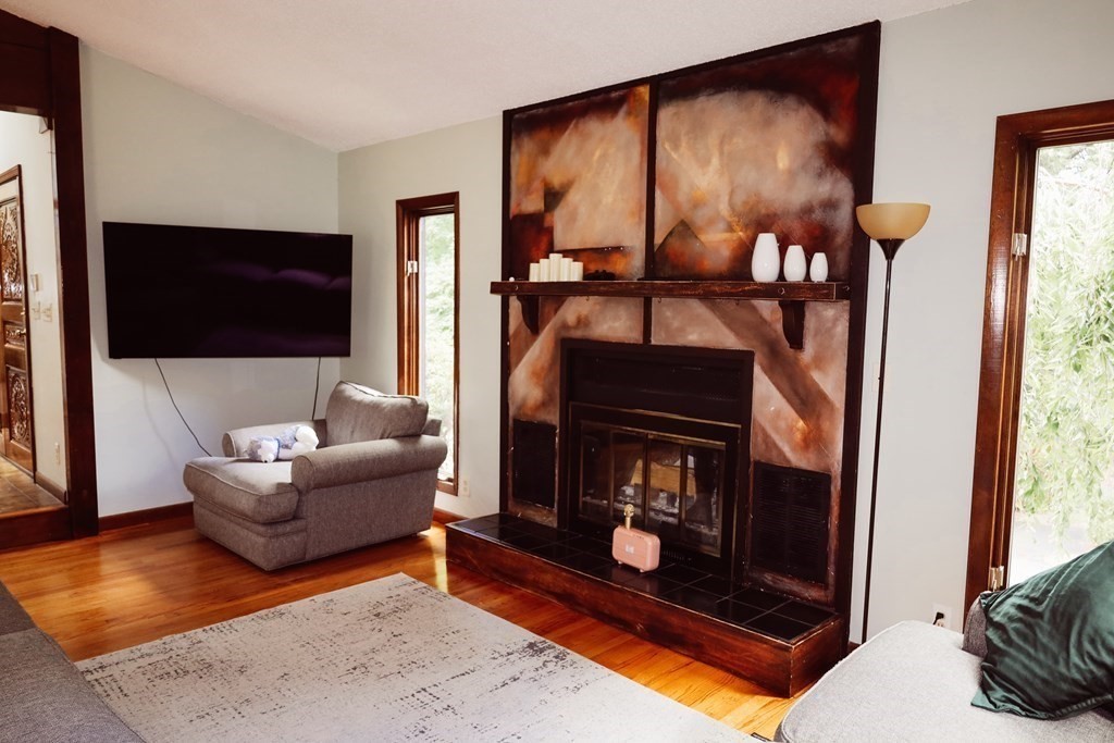 80 Rock-A-Dundee Road Hampden, MA 01036 - Photo 34 of 42 a living room with furniture a flat screen tv and a fireplace