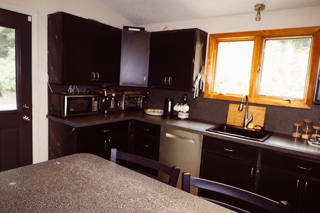80 Rock-A-Dundee Road Hampden, MA 01036 - Photo 36 of 42 a kitchen with a sink appliances cabinets and a window