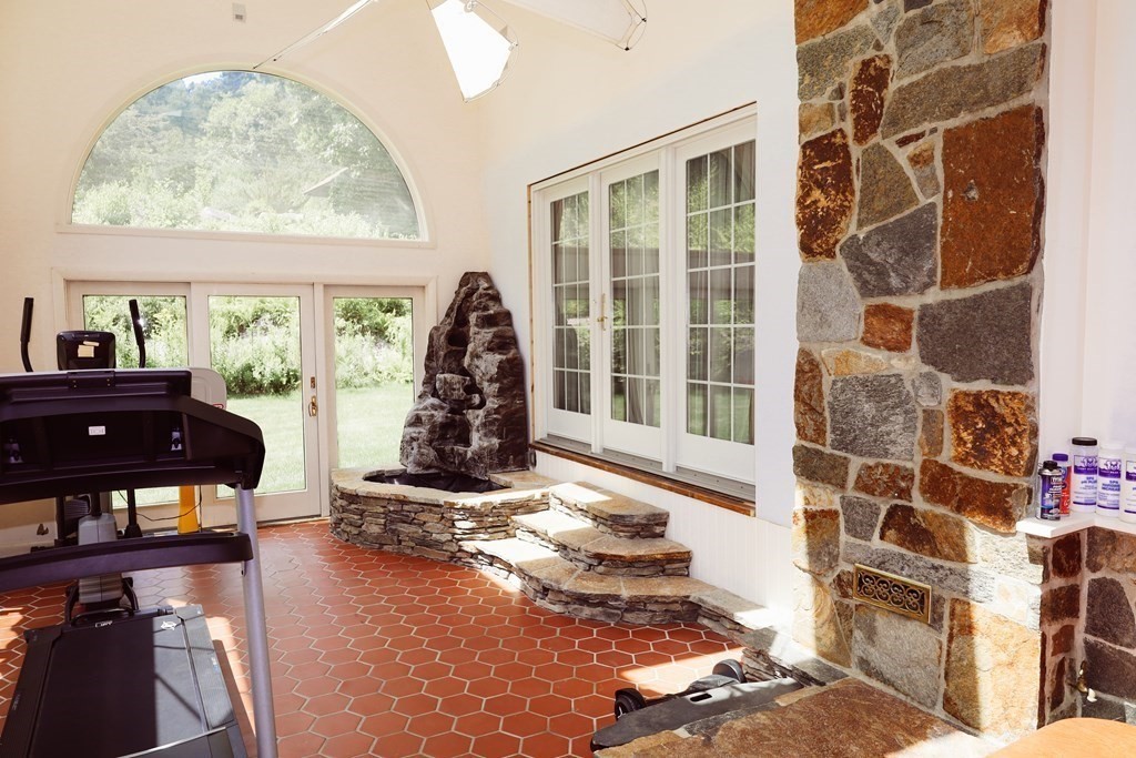 80 Rock-A-Dundee Road Hampden, MA 01036 - Photo 38 of 42 a living room with furniture and a floor to ceiling window