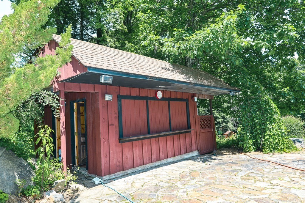 80 Rock-A-Dundee Road Hampden, MA 01036 - Photo 41 of 42 a front view of a house with a garden