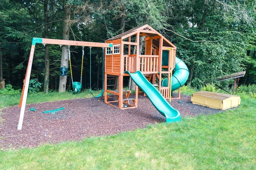 80 Rock-A-Dundee Road Hampden, MA 01036 - Photo 6 of 42 a front view of a house with a yard