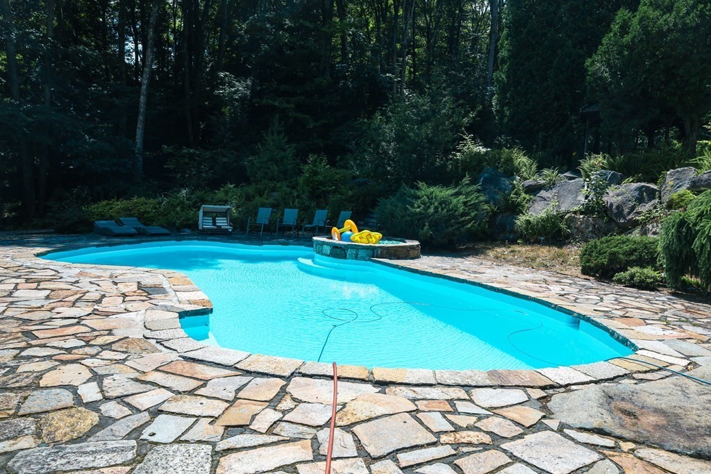 80 Rock-A-Dundee Road Hampden, MA 01036 - Photo 7 of 42 a swimming pool with potted plants and large trees