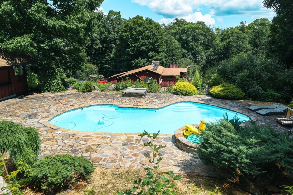 80 Rock-A-Dundee Road Hampden, MA 01036 - Photo 9 of 42 a view of a swimming pool with a yard