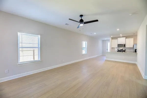a view of an empty room with a window