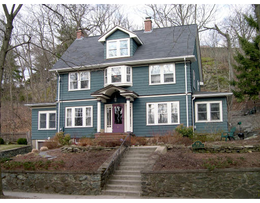 64 Oak Cliff Road Newton, MA 02460 - Photo 1 of 21 a front view of a house with a yard