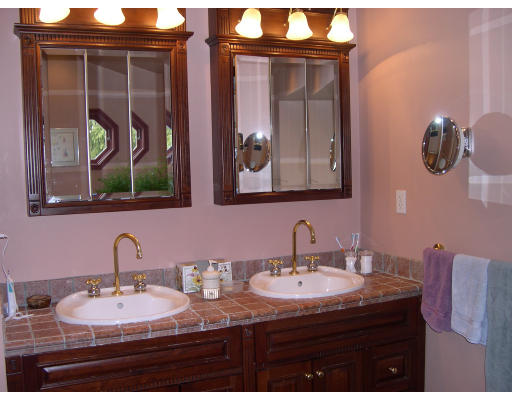 64 Oak Cliff Road Newton, MA 02460 - Photo 16 of 21 a bathroom with a sink and a mirror