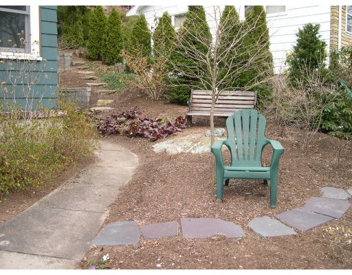64 Oak Cliff Road Newton, MA 02460 - Photo 19 of 21 a view of a bench in the patio